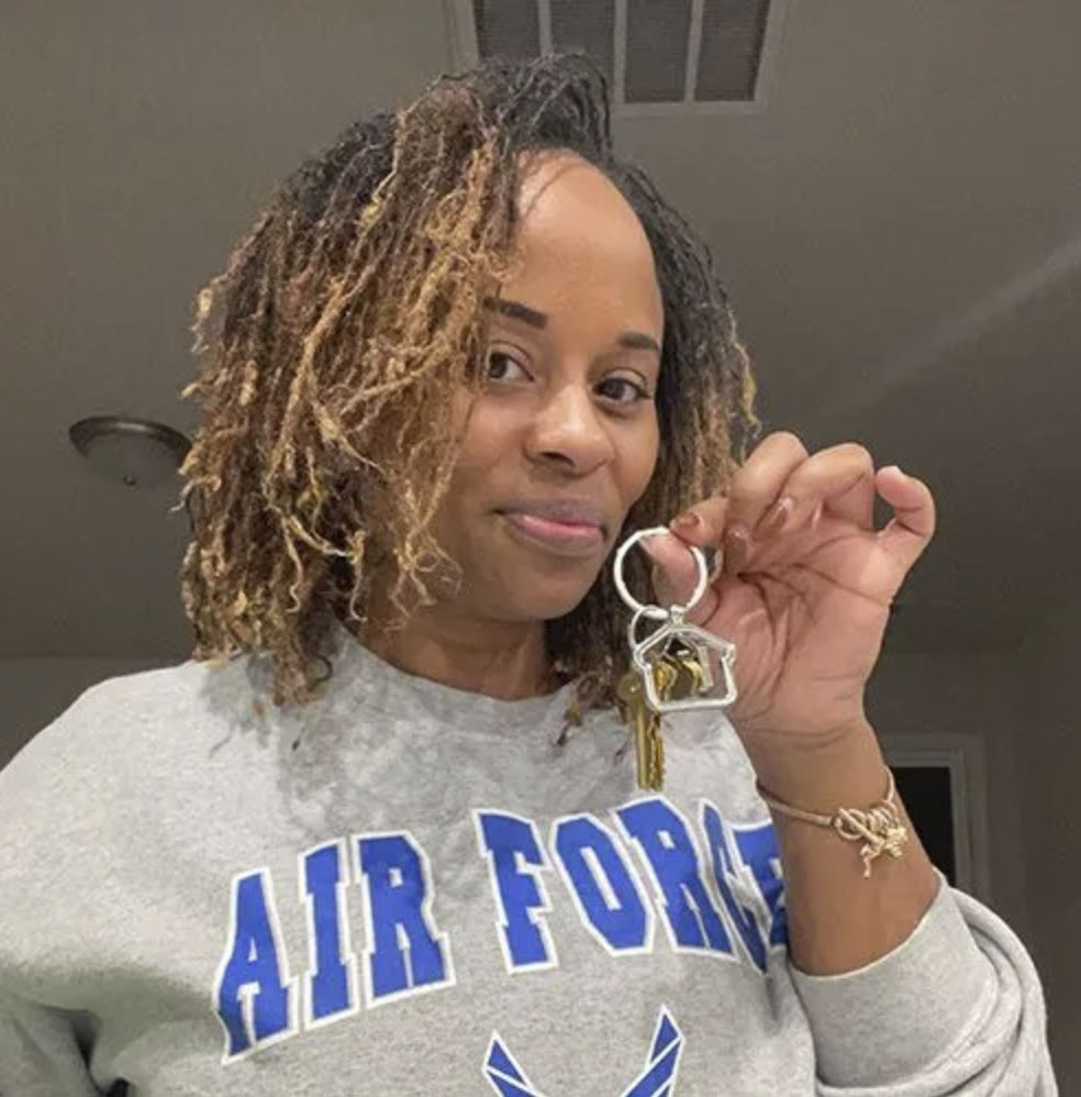 picture of Crystal J. in front of a house