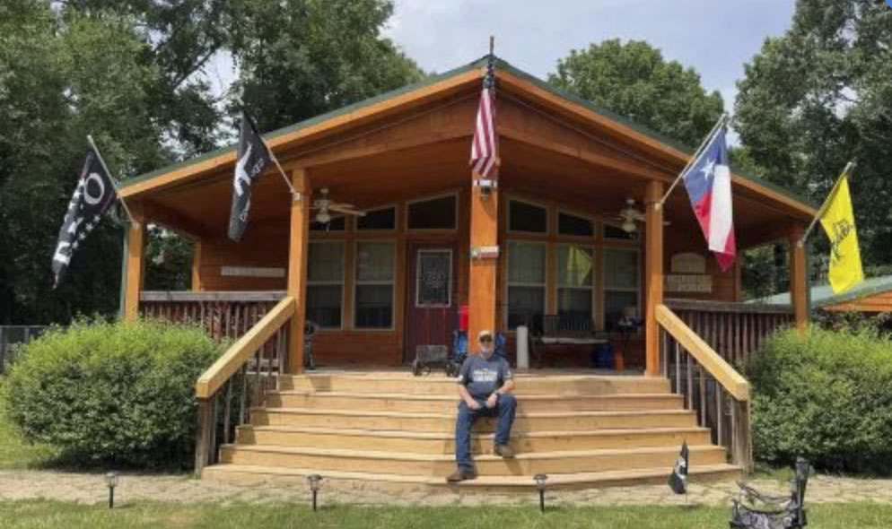 picture of Phillip P. in front of a house