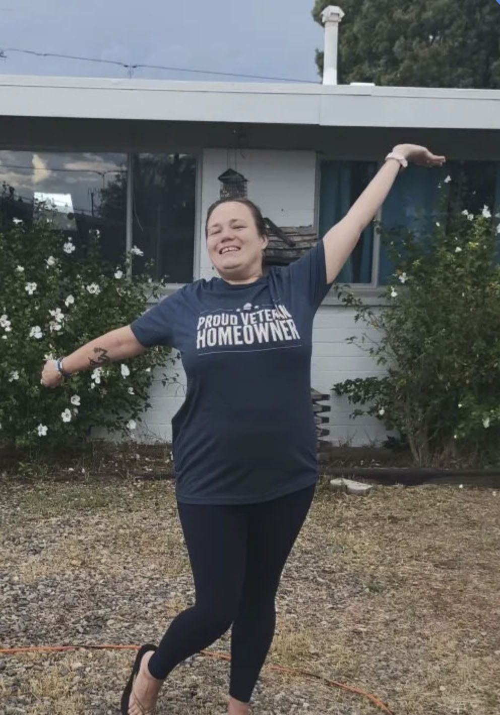 picture of Marquella T. in front of a house