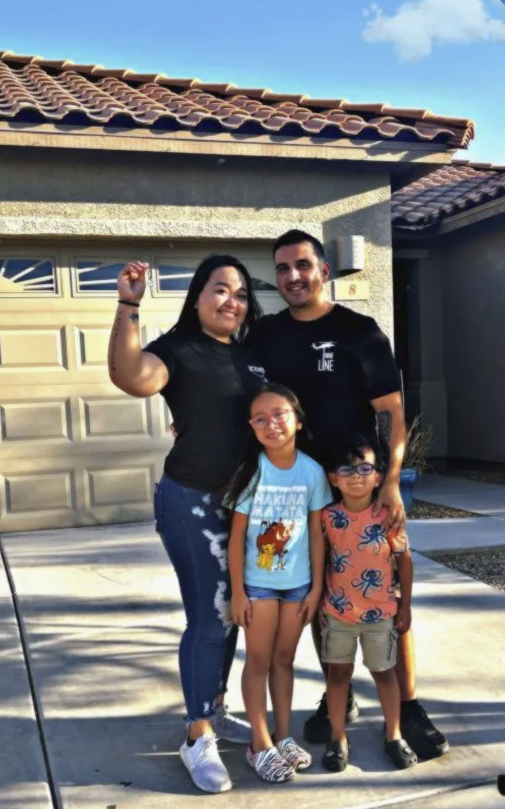 picture of Maylynn P. in front of a house
